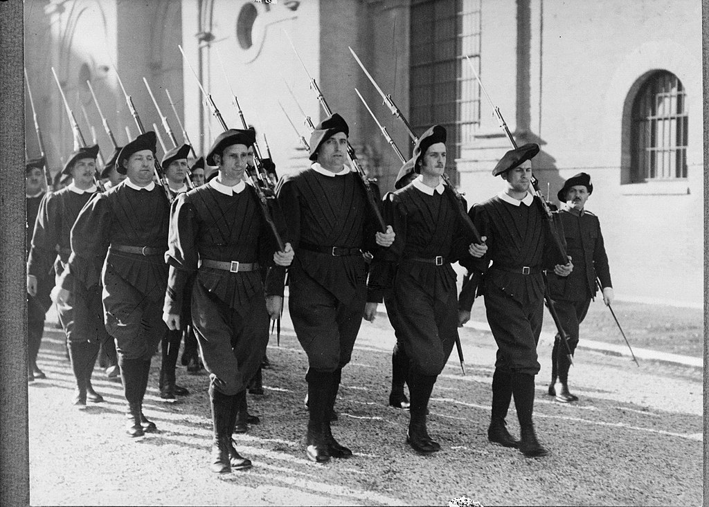 Marching in exercise uniform with Gewehr 98 rifles, 1938. Public domain.