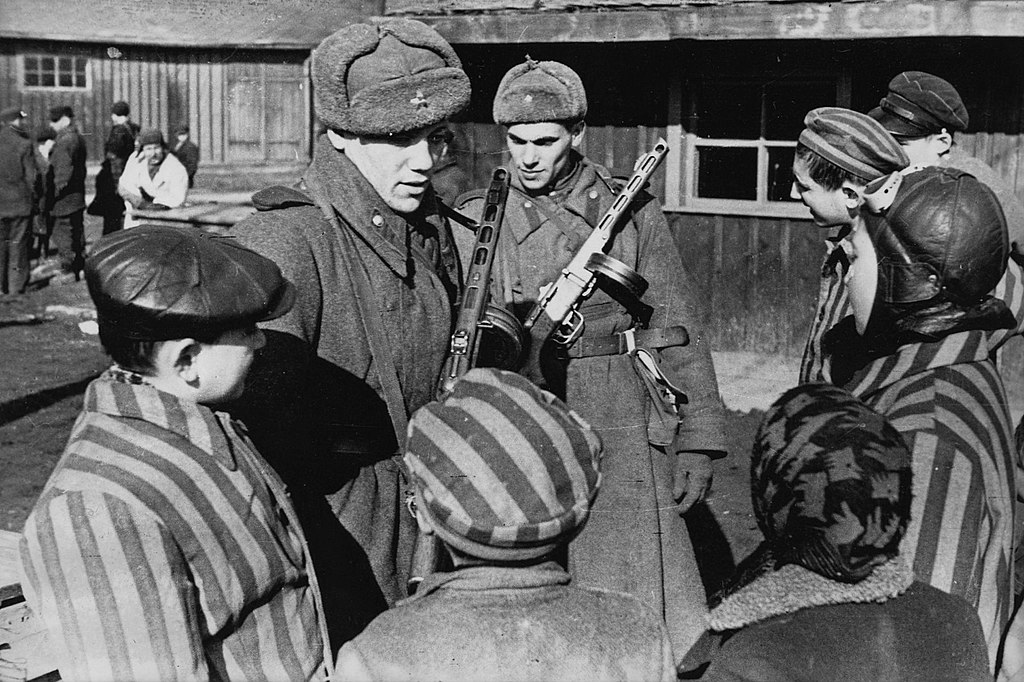 Soviet Army soldiers chatting to the children just liberated from the Auschwitz concentration camp. Public domain. Soviet Army soldiers chatting to the children just liberated from the Auschwitz concentration camp. Public domain.