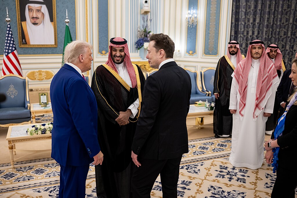 Musk with President Trump and Saudi Crown Prince Mohammed bin Salman during Trump's visit to the Middle East in May 2025. Public domain. Musk with President Trump and Saudi Crown Prince Mohammed bin Salman during Trump's visit to the Middle East in May 2025. Public domain.