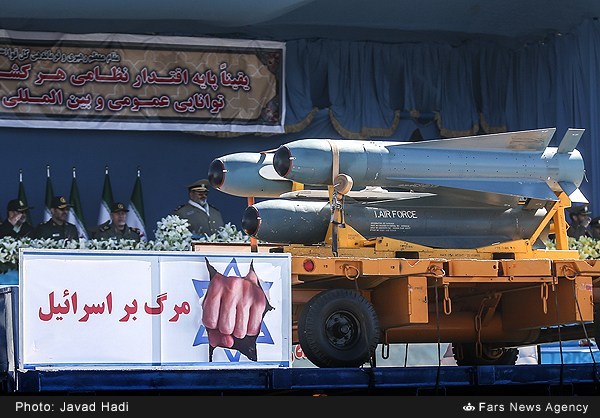 The words "Death to Israel" in Persian displayed on a parade in Iran. Iran's nuclear program is seen as a means to destroy Israel or threaten its existence. This photo was taken at the 2016 Islamic Republic of Iran Army Day parade in Tehran. Photo by Javad Hadi. The words "Death to Israel" in Persian displayed on a parade in Iran. Iran's nuclear program is seen as a means to destroy Israel or threaten its existence. This photo was taken at the 2016 Islamic Republic of Iran Army Day parade in Tehran. Photo by Javad Hadi.