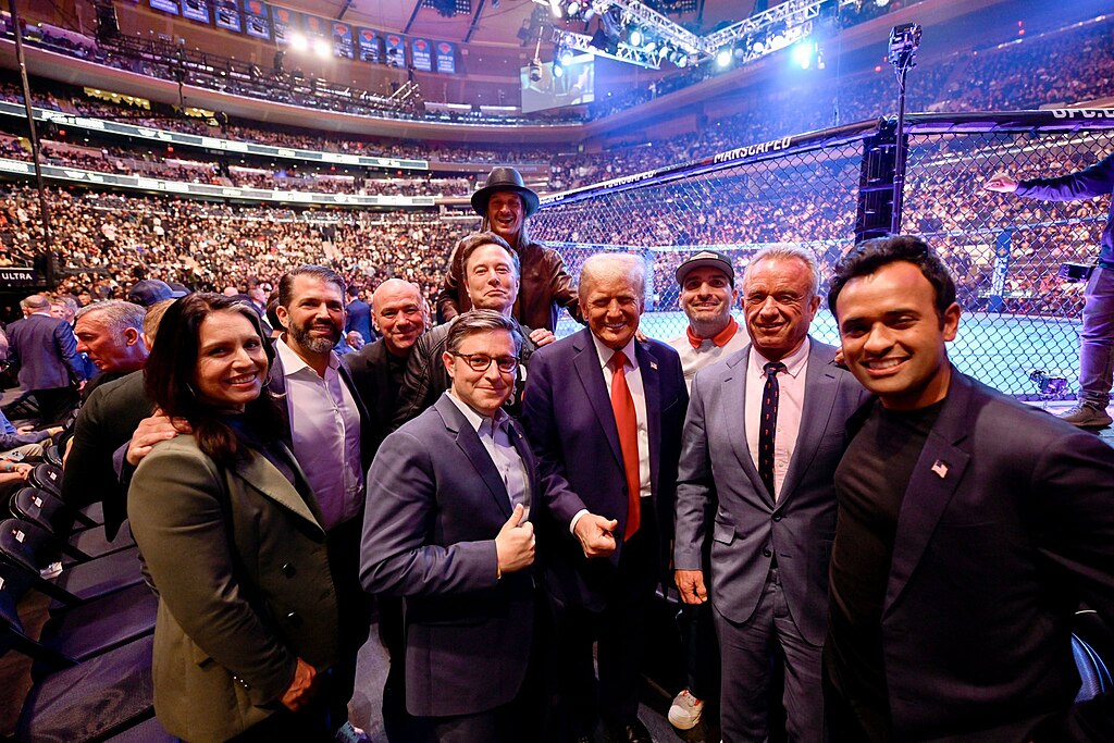 Donald Trump with Elon Musk, Tulsi Gabbard, RFK Jr, Mike Johnson, Vivek Ramaswamy, Donald Trump Jr, Dana White, and Kid Rock. 2024. Public domain. Donald Trump with Elon Musk, Tulsi Gabbard, RFK Jr, Mike Johnson, Vivek Ramaswamy, Donald Trump Jr, Dana White, and Kid Rock. 2024. Public domain.