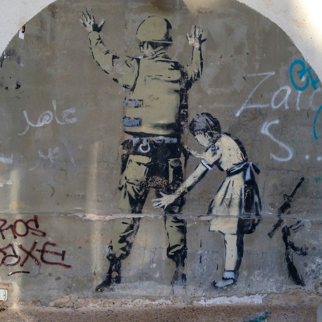 Graffiti done by Banksy in West Bank, Palestine. Photo by Dan Meyers. Graffiti done by Banksy in West Bank, Palestine. Photo by Dan Meyers.